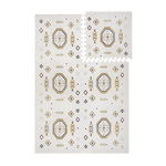 Interlocking foam tiles with lifted corner showing puzzle edges of the toddlekind baby toddler foam modern designer puzzle play mat haven amira golden clay.