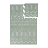 Interlocking green foam tiles with one tile removed from toddlekind baby toddler foam modern designer puzzle play mat haven berber moss.