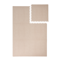 Interlocking foam tiles with one piece removed showing toddlekind baby toddler foam modern designer puzzle play mat haven deco latte.