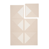 Interlocking neutral tiles with one tile removed from toddlekind baby toddler foam modern designer puzzle play mat haven kyte mocha.