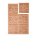 Interlocking tiles arranged in a grid with one corner lifted showing the toddlekind baby toddler foam modern designer puzzle play mat haven linear camel.