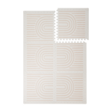 Interlocking foam tiles arranged in a grid with one corner lifted showing edges of the toddlekind baby toddler foam modern designer puzzle play mat haven linear linen.