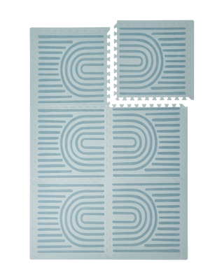 Interlocking tiles arranged in a grid with one piece lifted showing the toddlekind baby toddler foam modern designer puzzle play mat haven linear mineral.