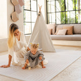 Mother and baby toddler playing with wooden toys on the toddlekind baby toddler foam modern designer puzzle play mat haven linear linen.