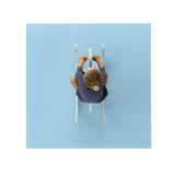 Overhead view of toddler riding toy on toddlekind baby toddler foam modern puzzle play mat classic slate in soft blue tone. Alt Img