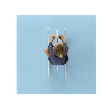 Overhead view of toddler riding toy on toddlekind baby toddler foam modern puzzle play mat classic slate in soft blue tone. Alt Img